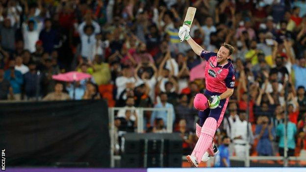 Jos Buttler jumping in the air and celebrating