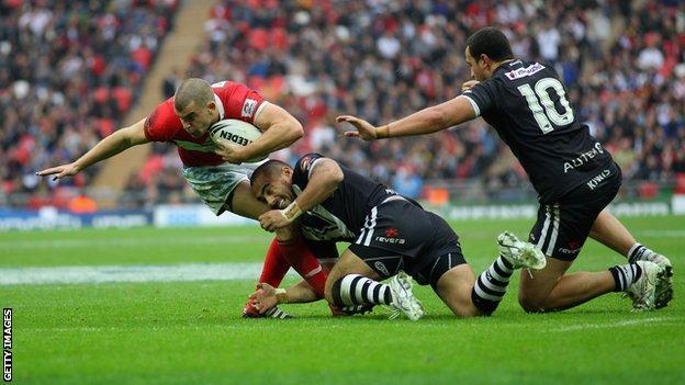 Elliott Kear of Wales is tackled during the Four Nations match between Wales and New Zealand at Wembley Stadium on November 5, 2011 in London, United Kingdom
