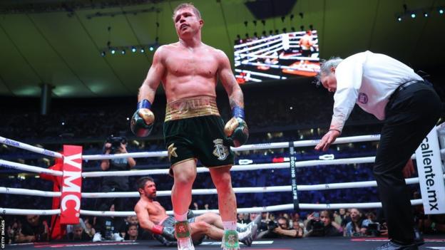 Saul 'Canelo' Alvarez stands arsenic  John Ryder lies connected  the canvas