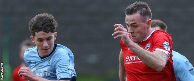 Institute's Callum Moorehead in action against Darren McCauley of Coleraine
