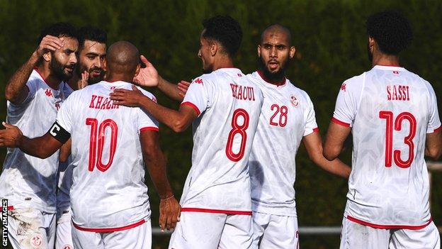 Tunisia celebrate a goal against Comoros