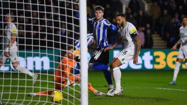 Josh Windass of Sheffield Wednesday scores against Newcastle United at Hillsborough