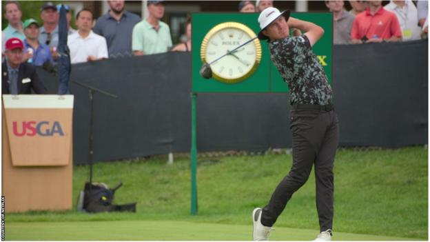 Golfer Joel Dahmen tees off.