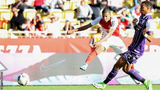 Monaco's French forward Kylian Mbappe scores against Toulouse