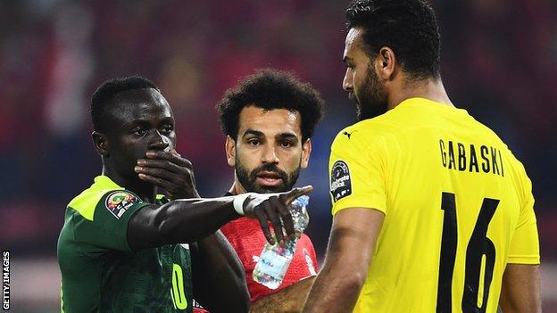 Sadio Mane speaks to Egypt keeper Gabaski before his first-half penalty
