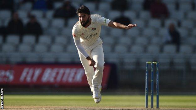 Fast bowler Saqib Mahmood bowling for Lancashire in a County Championship match