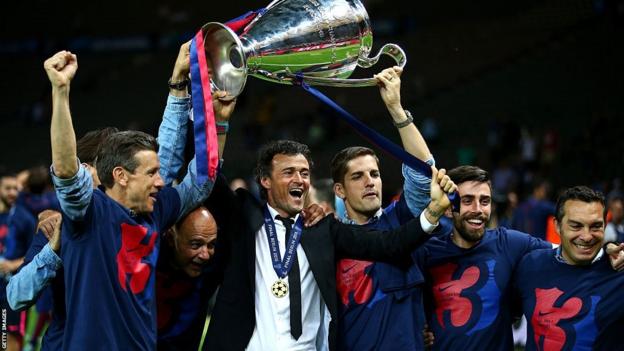 Luis Enrique lifts the Champions League trophy with his Barcelona coaching staff in 2014-15