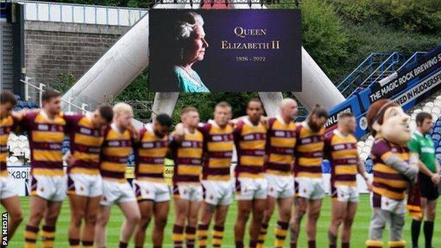 Players observe a minute's silence at Huddersfield Giants v Salford Red Devils
