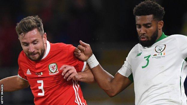Wales' Paul Dummett and Republic of Ireland's Cyrus Christie compete for the ball