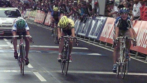 Three cyclists at the finish line of a race