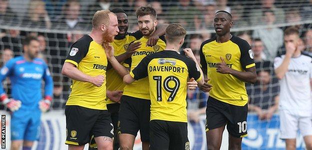 Burton players celebrate scoring a goal against Derby County