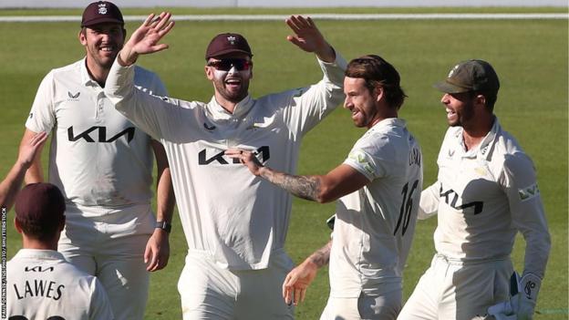 Surrey's Jordan Clark took the final wicket to finish off Warwickshire