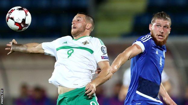 Conor Washington and Juri Biordi in action during the first half