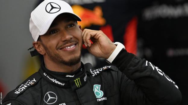 Lewis Hamilton smiles after finishing second in Spain