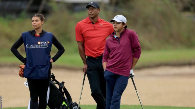 Tiger, Charlie and Sam Woods on the course at the PNC Championship