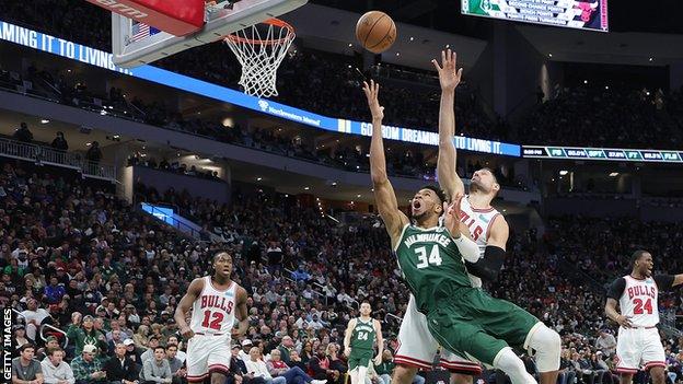 Giannis Antetokounmpo scores for the Milwaukee Bucks against the Chicago Bulls in Wednesday's NBA play-off game