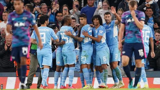 Manchester City's players celebrate scoring against RB Leipzig in the Champions League