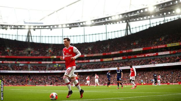 Mesut Ozil in action against West Ham on 7 March