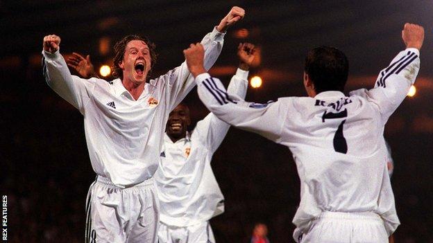 Steve McManaman celebrates winning the 2002 Champions League final with Real Madrid teammate Raul