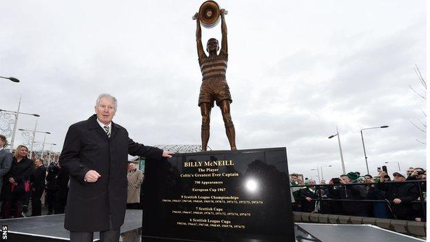 Billy McNeill stands alongside his statue