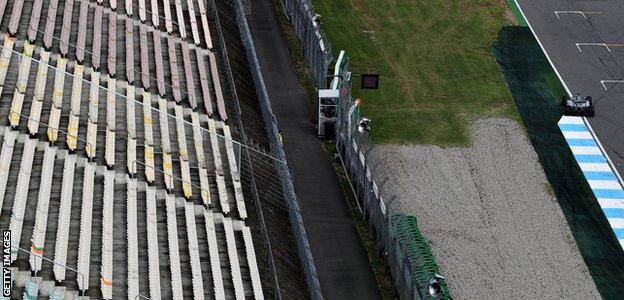 Lewis Hamilton drives past an empty grandstand during a practice session for the German Grand Prix in 2016