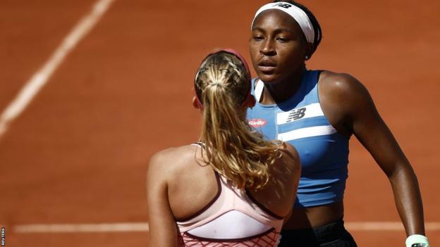 Coco Gauff shakes hands with Mirra Andreeva after their French Open match