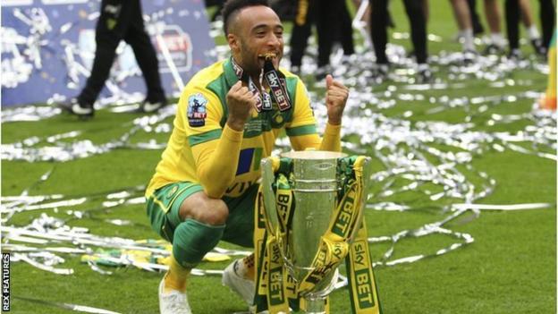 Nathan Redmond celebrates after helping Norwich win promotion