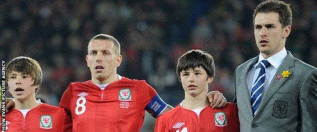 Gary Speed's sons Ed and Tommy with Craig Bellamy and Aaron Ramsey.