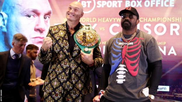 Tyson Fury smiles alongside Derek Chisora