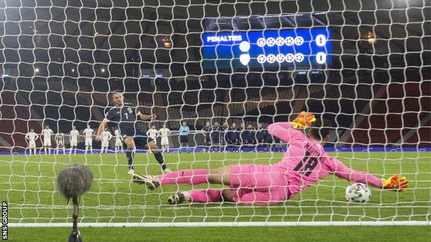 Israel goalkeeper Ofir Marciano just fails to keep out John McGinn's penalty in the Euro 2020 play-off semi-final