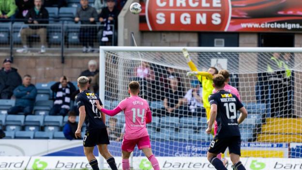 Luke McCowan watches his chip fly into the net