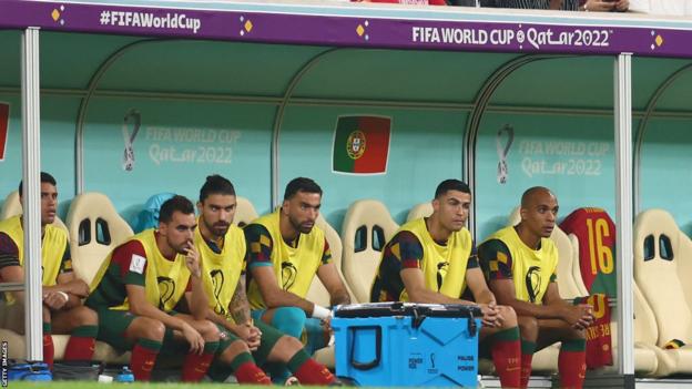 Cristiano Ronaldo sits on the bench against Switzerland