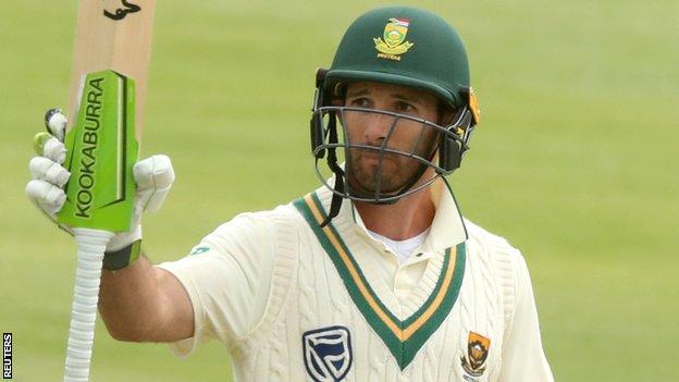 South Africa opener Pieter Malan raises his bat to celebrate reaching his maiden Test fifty on day four of the second Test against England