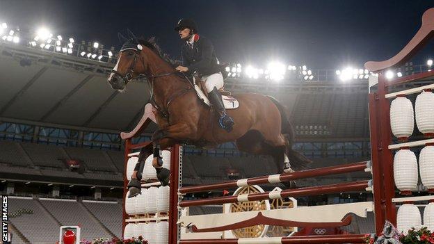 Joe Choong jumps on a horse at Tokyo 2020