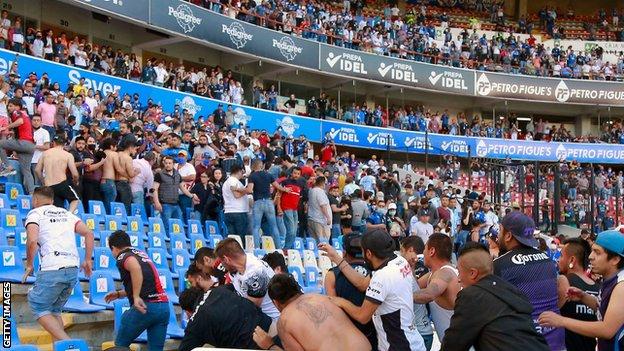 Fighting in the stands at La Corregidora stadium