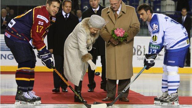 The Queen drops an ice hockey puck before a match between the Guildford Flames and Aquacity Poprad in Slovakia