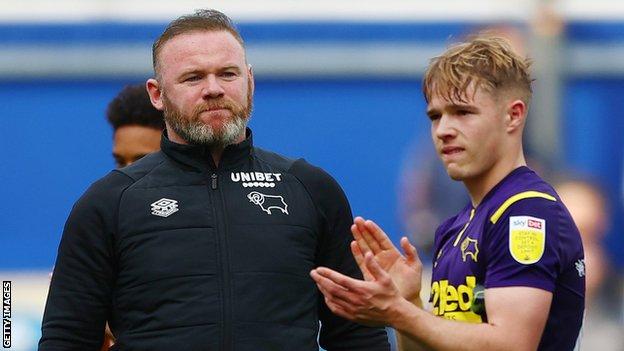 Derby County boss Wayne Rooney looks on