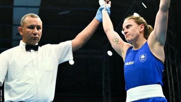Michaela Walsh has her hand raised