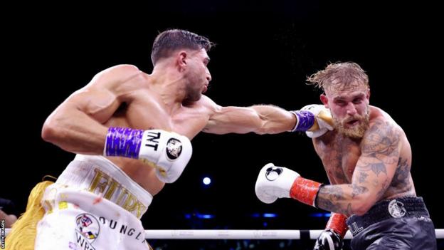 Tommy Fury throws a jab against Jake Paul