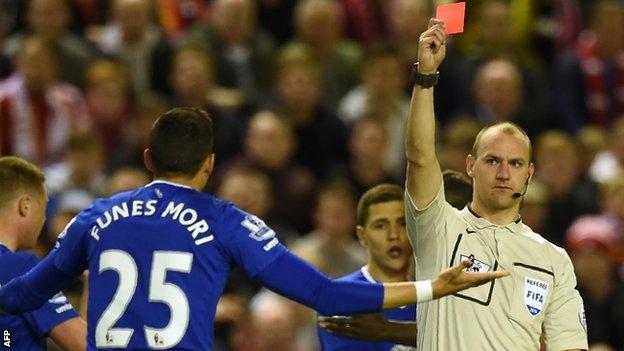 Ramiro Funes Mori is shown the red card by referee Robert Madley