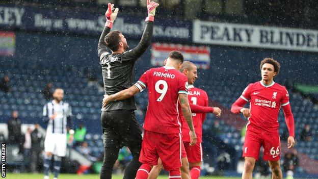 Alisson looks up to the sky after scoring