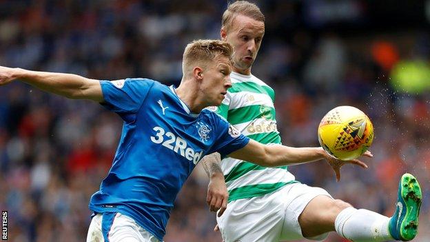 Rangers' Ross McCrorie challenges Celtic's Leigh Griffiths