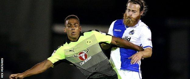 Stuart Sinclair of Bristol Rovers tackles Andy Rinomhoto of Reading in Checkatrade Trophy