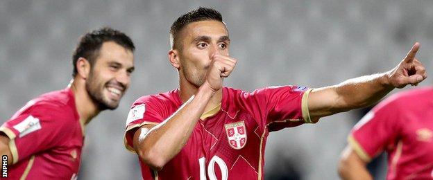Dusan Tadic (right) celebrates after scoring his penalty