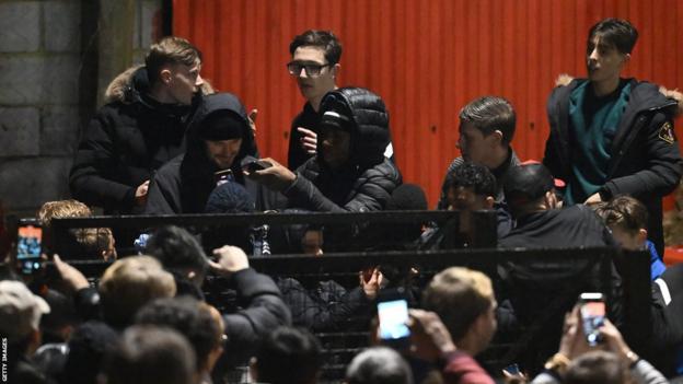 David Beckham surrounded by fans