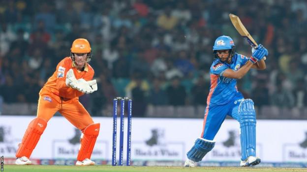 Mumbai Indians' captain Harmanpreet Kaur plays a shot against Gujarat Giants