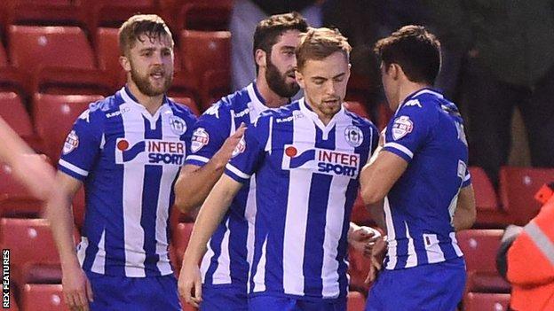 Wigan celebrate Andy Kellett's opening goal at Barnsley