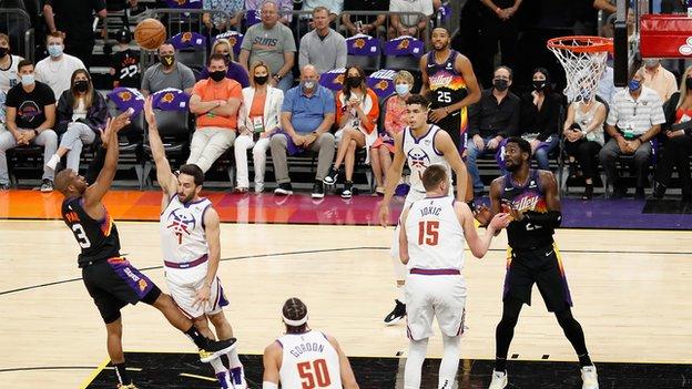 Chris Paul shoots for the Phoenix Suns