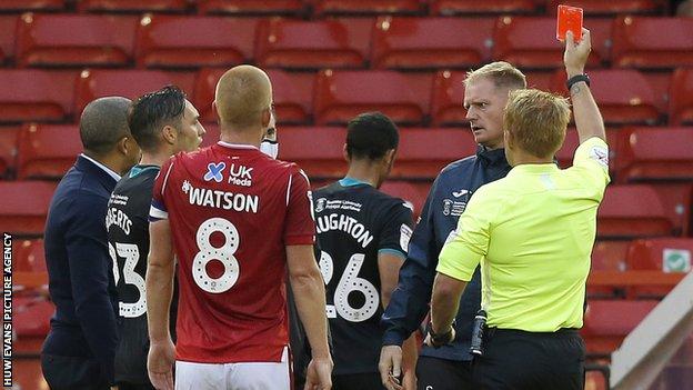 Swansea's Kyle Naughton was sent off late on by referee Oliver Langford for a tackle on Forest's Alex Mighten