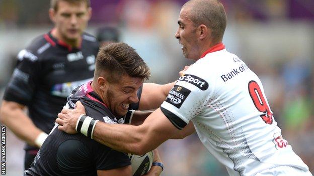 Ospreys' Rhys Webb grapples with Ulster scrum-half Ruan Pienaar